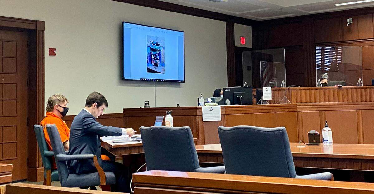 Bryan Carroll (left) looked on as prosecutors presented a photo of what University of Kentucky detectives thought was an improvised explosive in Carroll’s vehicle the day he was arrested outside UK Hospital. The device wasn’t an explosive, according to Lexington investigators, but investigators found five explosives in Carroll’s vehicle.