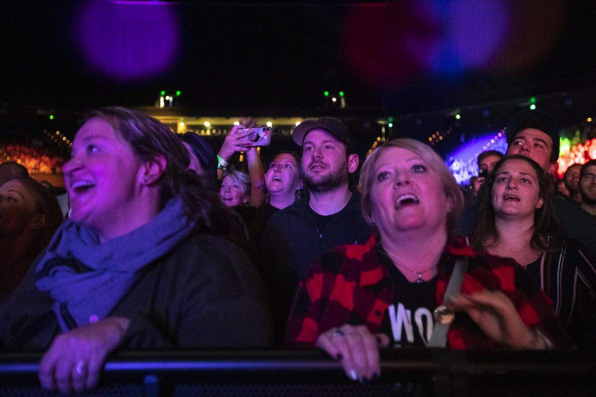 Fans listen as the Avett Brothers perform during a Saturday concert at Rupp Arena. Just over 5,000 were in attendance for the show.