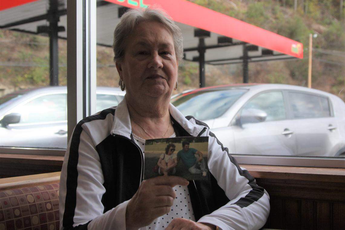 Patty Amburgey holds up a photo of her husband, Crawford, who died of black lung at the age of 65.