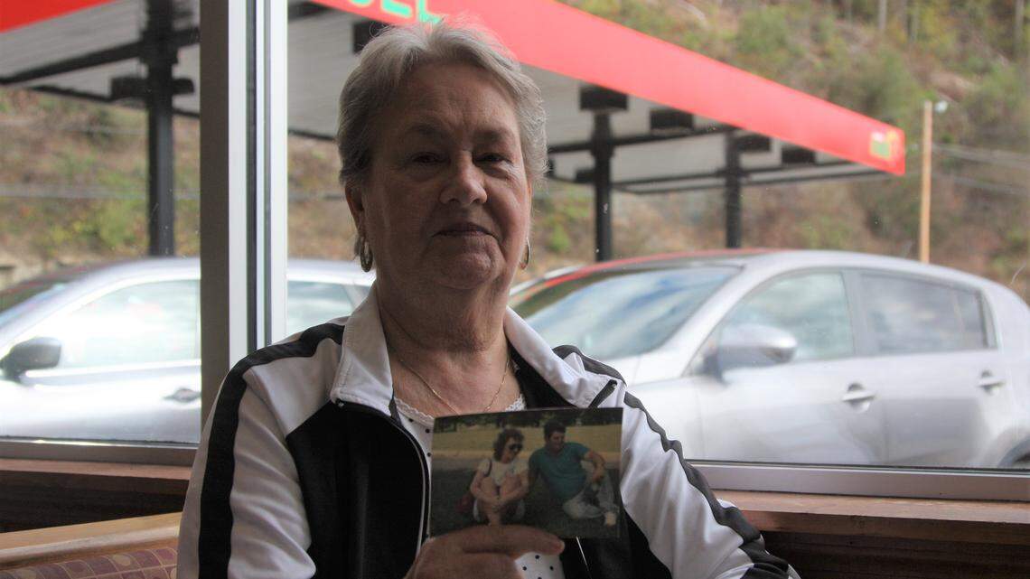 Patty Amburgey holds up a photo of her husband, Crawford, who died of black lung at the age of 65.
