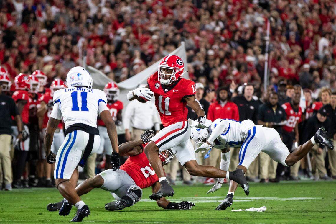Georgia wide receiver Arian Smith (11) runs the ball against Kentucky during Saturday’s game at Sanford Stadium in Athens, Ga.
