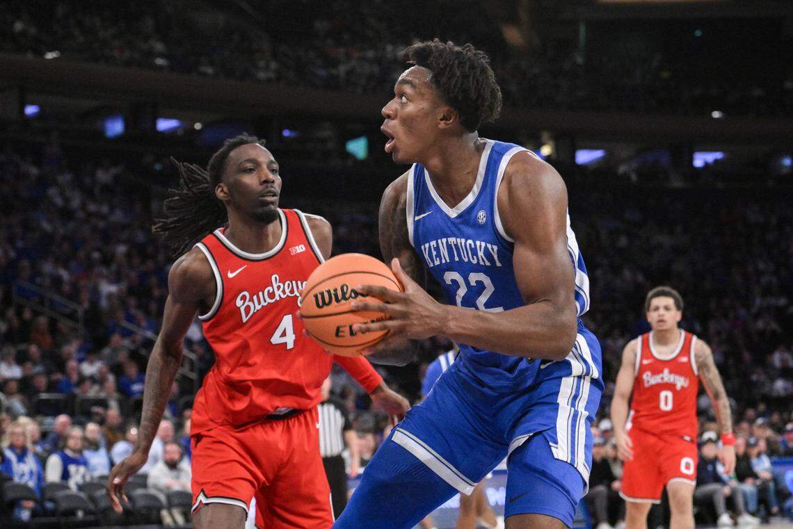 Dec 21, 2024; New York, New York, USA; Kentucky Wildcats center Amari Williams (22) looks to shoot the ball as Ohio State Buckeyes forward Aaron Bradshaw (4) defends during the first half at Madison Square Garden. Mandatory Credit: John Jones-Imagn Images