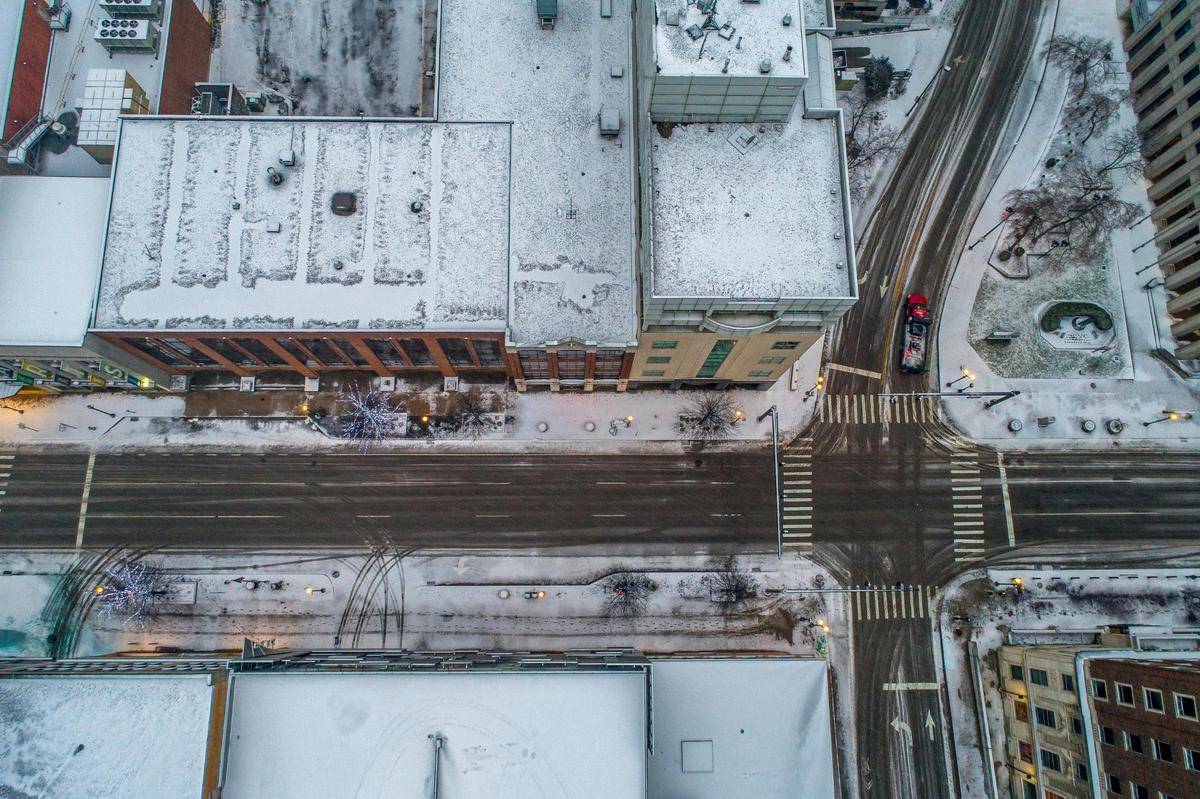 Snow covers building tops and sidewalks in downtown Lexington, Ky., on Friday, Feb. 4, 2022.