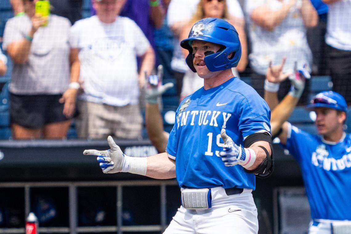 Jun 15, 2024; Omaha, NE, USA; Kentucky Wildcats center fielder Nolan McCarthy (19) celebrates after a two-run home run against the NC State Wolfpack during the fourth inning at Charles Schwab Filed Omaha. Mandatory Credit: Dylan Widger-USA TODAY Sports