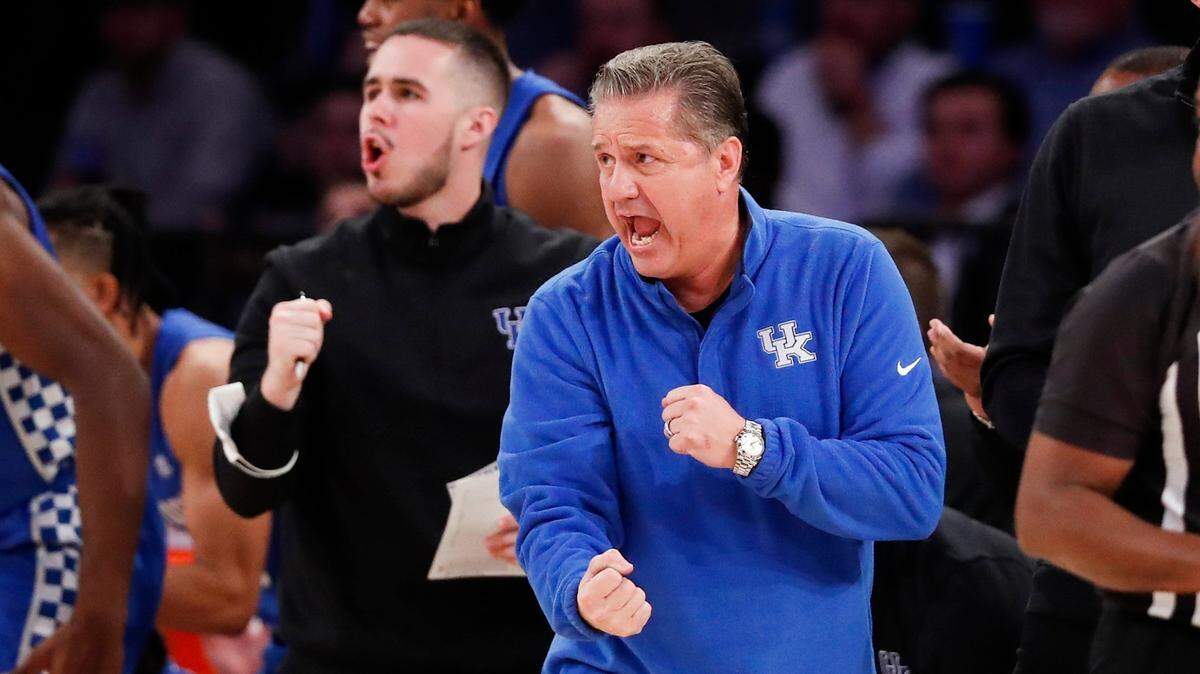Brad Calipari, left, spent the 2021-22 season as a graduate assistant under his father, John Calipari, at Kentucky.