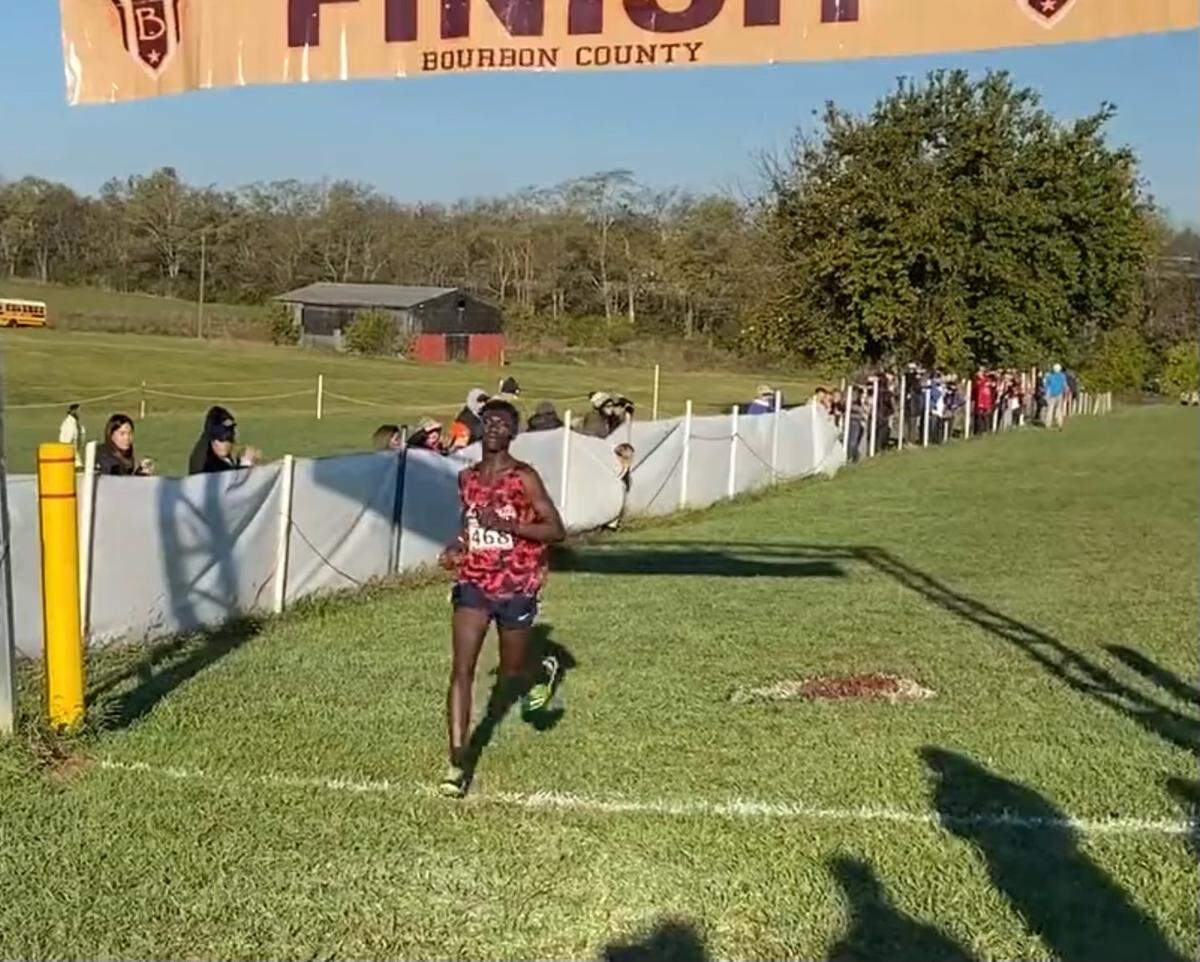 Lafayette’s James Ndayishimiye, a Congolese refugee, wins the Class 3A Region 6 boys cross country championship at Bourbon County Park on Saturday.