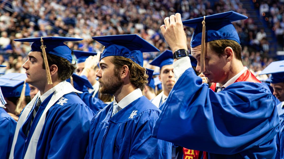 UK graduates moving their tassels from left to right, symbolizing the transition from a degree candidate to a graduate in the completion of an academic journey during the first of two UK graduation ceremonies at Central Bank Center on May 9, 2025, in Lexington, Ky.