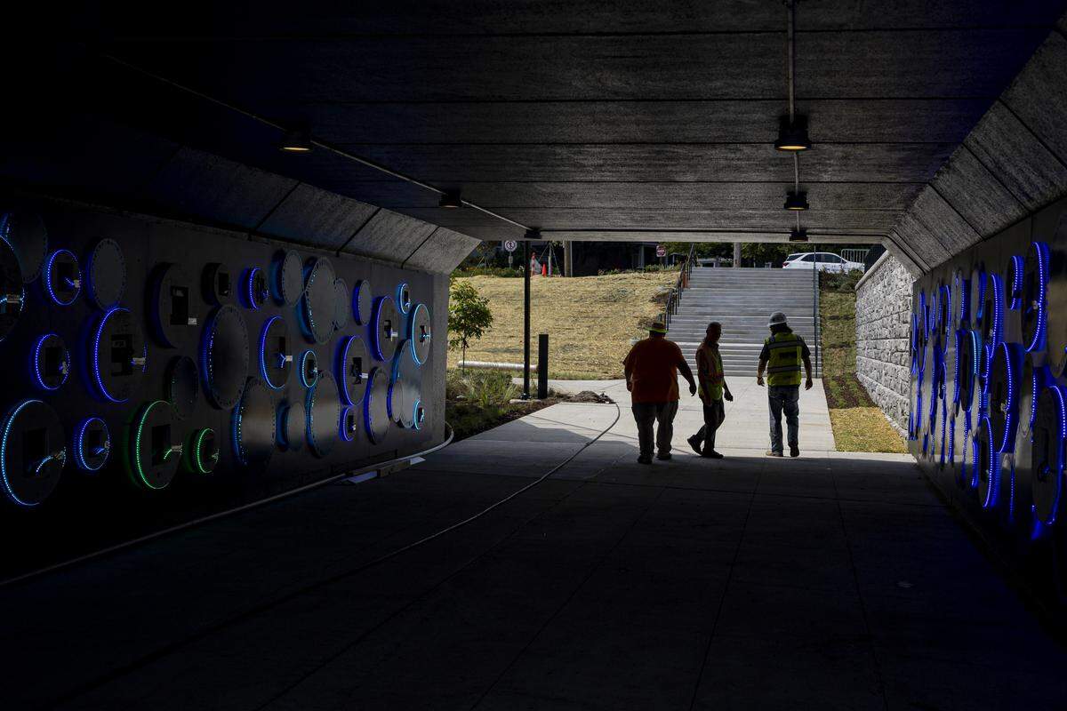 The tunnel entrance on High Street, adorned by lights, during a tour on Thursday, Aug. 14, 2025, at Gatton Park on the Town Branch in Lexington, Ky. 