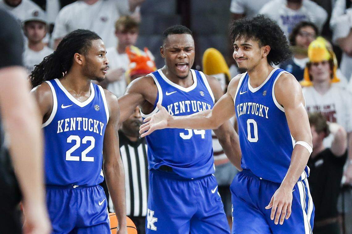 Kentucky’s Oscar Tshiebwe (34) celebrates Wednesday’s victory against Mississippi State with teammates Cason Wallace (22) and Jacob Toppin (0).
