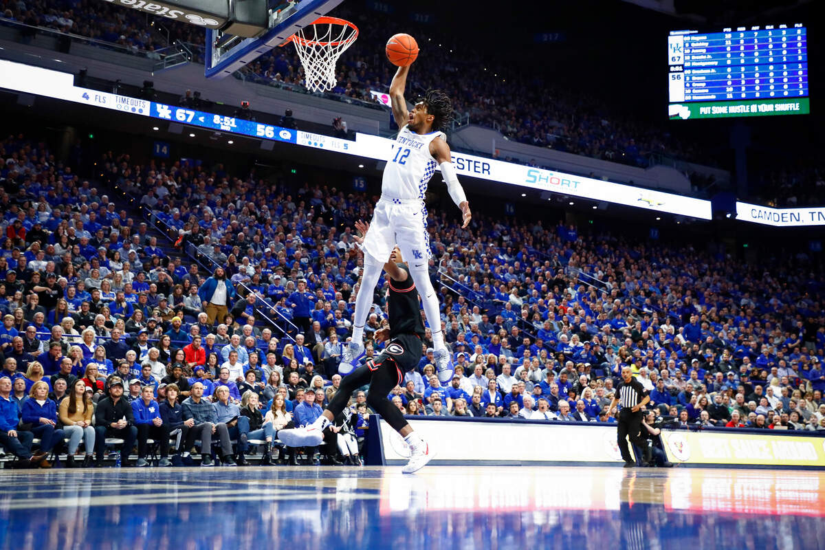 Kentucky Wildcats forward Keion Brooks Jr. slam dunks the ball over Georgia Bulldogs forward Christian Brown during their game at Rupp Arena in Lexington, Ky., Tuesday, Jan. 21, 2020.