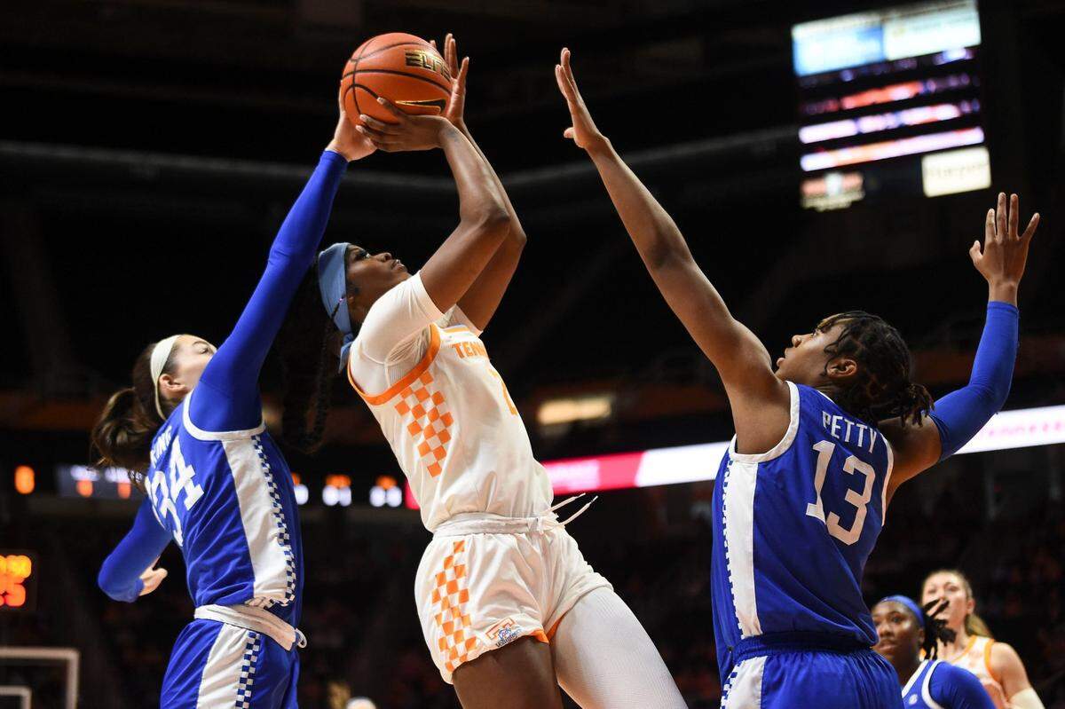 Tennessee’s Rickea Jackson, center, attempts to score while guarded by Kentucky’s Emma King (34) and Ajae Petty (13). Jackson led the Lady Vols with 27 points.