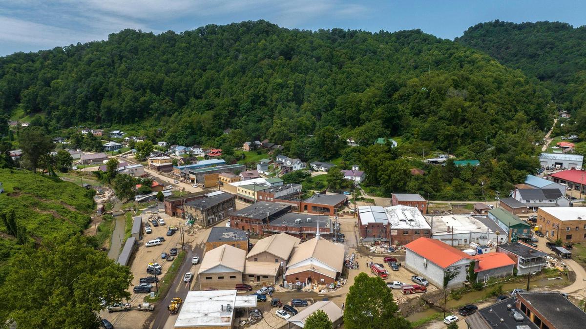 Mud and dirt cover streets in Fleming-Neon, Ky., on Wednesday, Aug. 3, 2022, following flash flooding.
