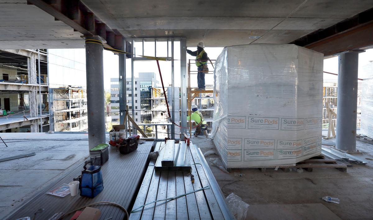 Construction continued Thursday morning on the eighth floor of The Residence Inn Lexington City Center, one of two Marriott hotel properties under construction at the City Center development. The Lexington Marriott City Center, a 230-room hotel, and The Residence Inn Lexington City Center, a 120-room extended stay hotel, should be completed by fall of 2019. The Bristol Group is utilizing several new construction techniques in the construction of these buildings. The plastic wrap on the right is protecting one of the bathrooms pods.