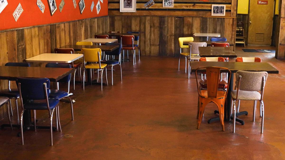 Joella’s Hot Chicken ensures social distancing for dining room customers by using tables with no seats to separate tables with seats.