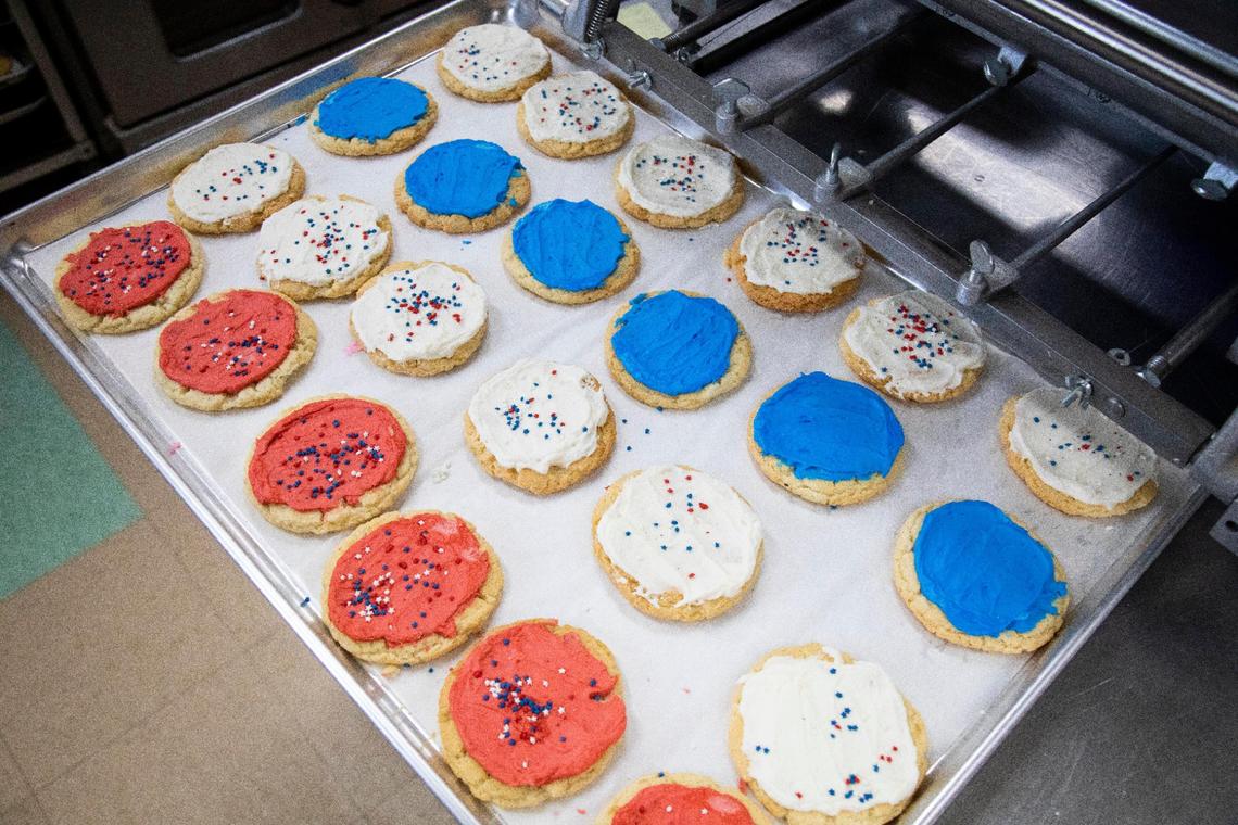 Two dozen frosted sugar cookies sit in the kitchen July 1 at Root-a-Baker Bakery in Morehead. Sugar cookies are one of Root-a-Baker Bakery best selling products.