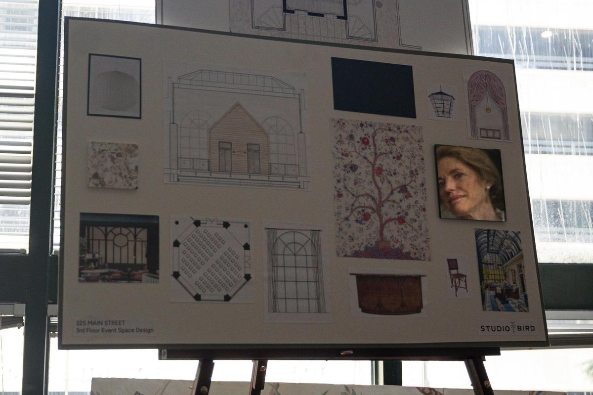 Kathryn Kaufman, a developer for the building, looks at design prints for the third floor event space on Friday, June 20, 2025, at 325 Main Street in Lexington, Ky.