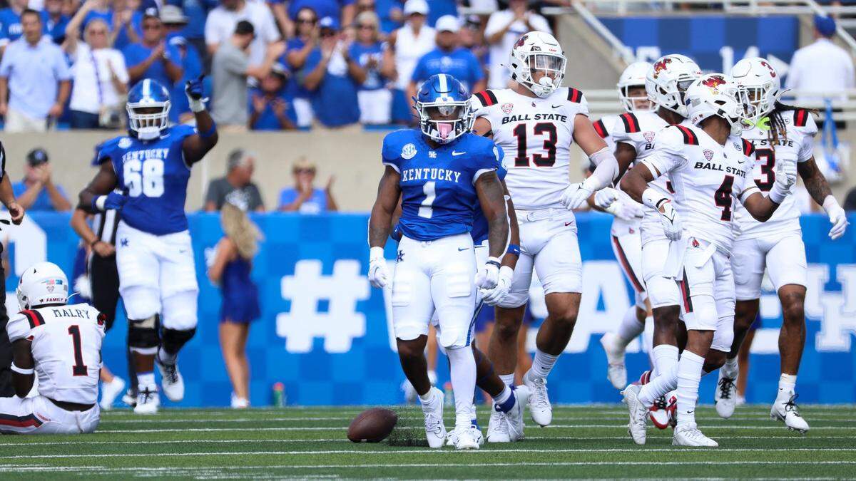 Kentucky running back Ray Davis (1) celebrates after a first-half run for a first down against Ball State.