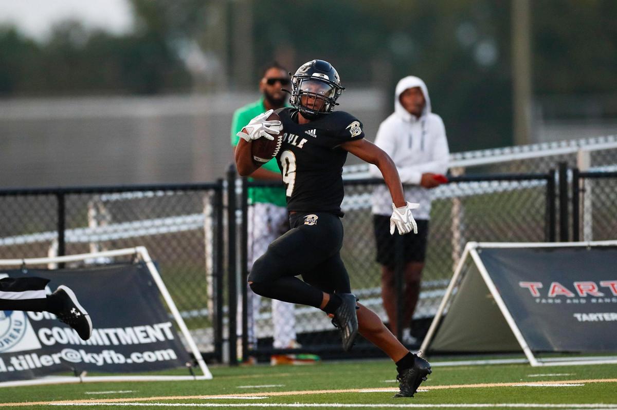 Boyle County’s Montavin Quisenberry (9) returns the opening kickoff for a touchdown against Bryan Station during Saturday’s game in Danville.