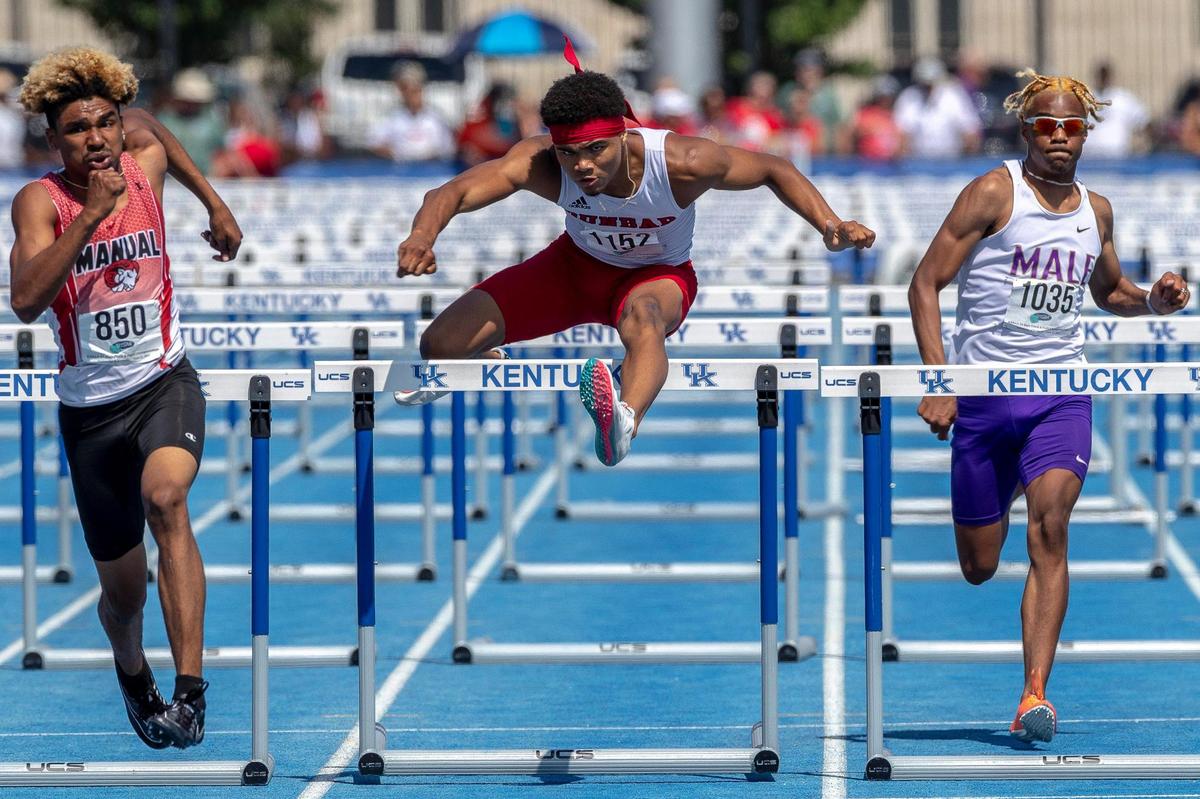 Paul Laurence Dunbar’s Mario Paul (center) finished second in the 110-meter hurdles, captured here, but came back later in the day to set a state record in the 300 hurdles.