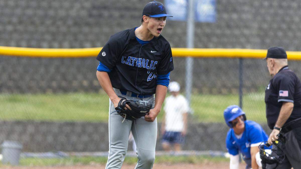 Lexington Catholic's Eamon Hughes (25) celebrates after Lexington Christian's Tyler King (2) was tagged out at third base during a 43rd district high school baseball game, Tuesday, April 28, 2026 at Lexington Christian High School in Lexington, Ky.