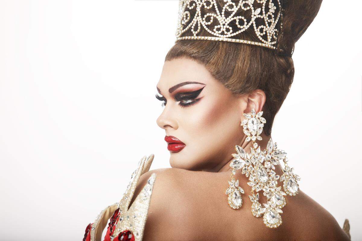 Scarlet Envy poses in a tiara and diamond jewelry. The drag queen starred on television shows including “RuPaul’s Drag Race” Season 11, “RuPaul’s Drag Race All Stars” Season 6, “RuPaul’s Drag Race: UK vs. the World,” and “Drag House Rules.”