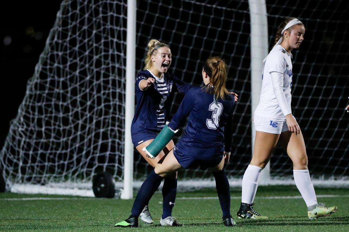 South Oldham’s Katie Beth May (8) celebrates scoring a goal against Lexington Catholic during the KHSAA Girls’ State Soccer Tournament semifinals at Frederick Douglass High School on Wednesday night.