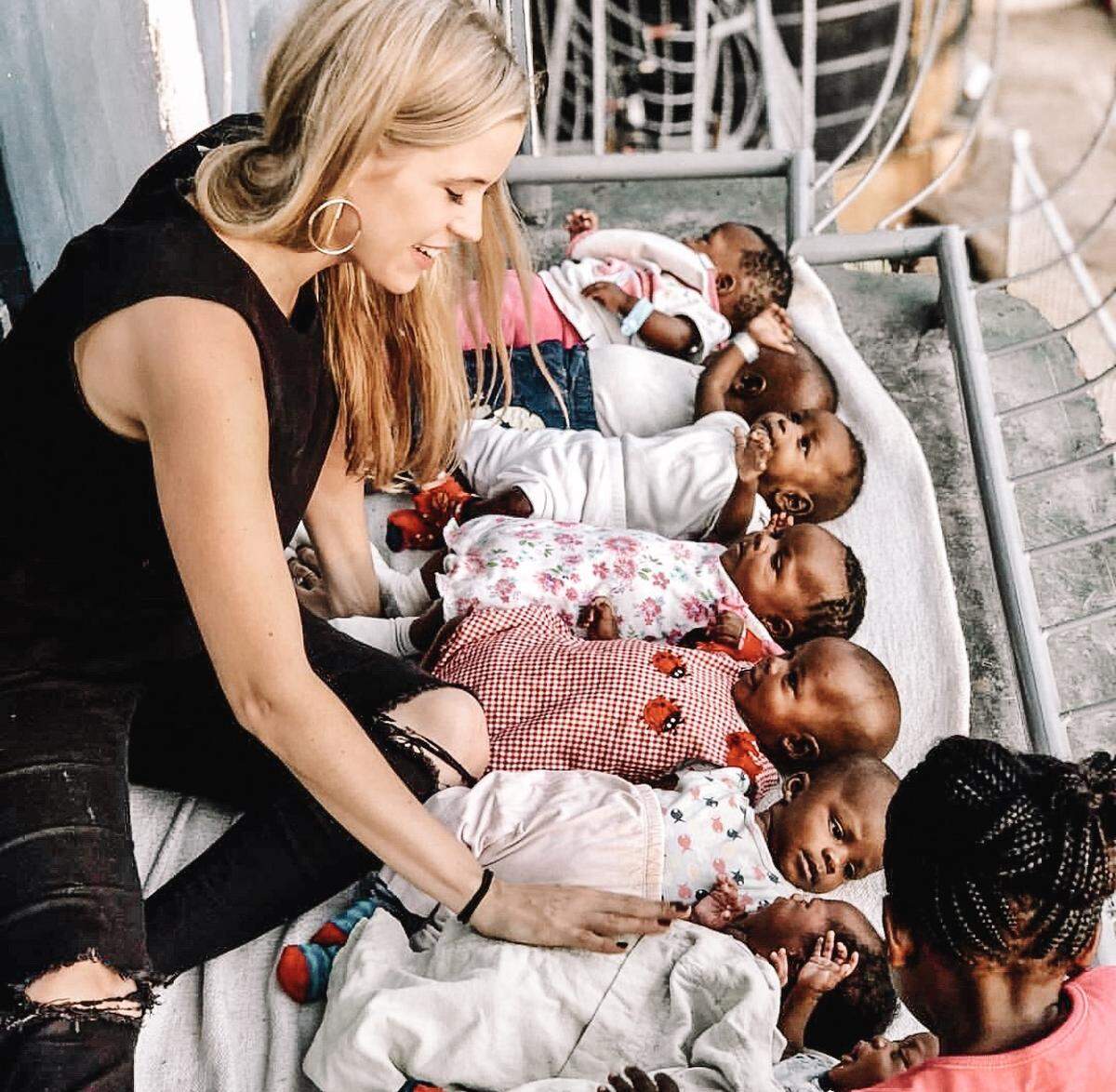 Amy Hehre was photographed with some of the babies at OVI Children’s Hospital in Migori, Kenya, which she co-founded with her husband, Robert.