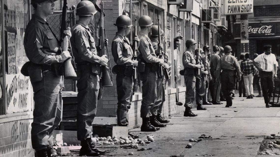 May 28, 1968; Louisville, KY, USA; National Guardsmen stand with rifles ready in front of looted stores on the east side of 28th Street between Dumesnil and Virginia. About a dozen West End stores were broken into on May 28, 1968.  Mandatory Credit: Rovert Steinau/Courier-Journal-USA TODAY NETWORK