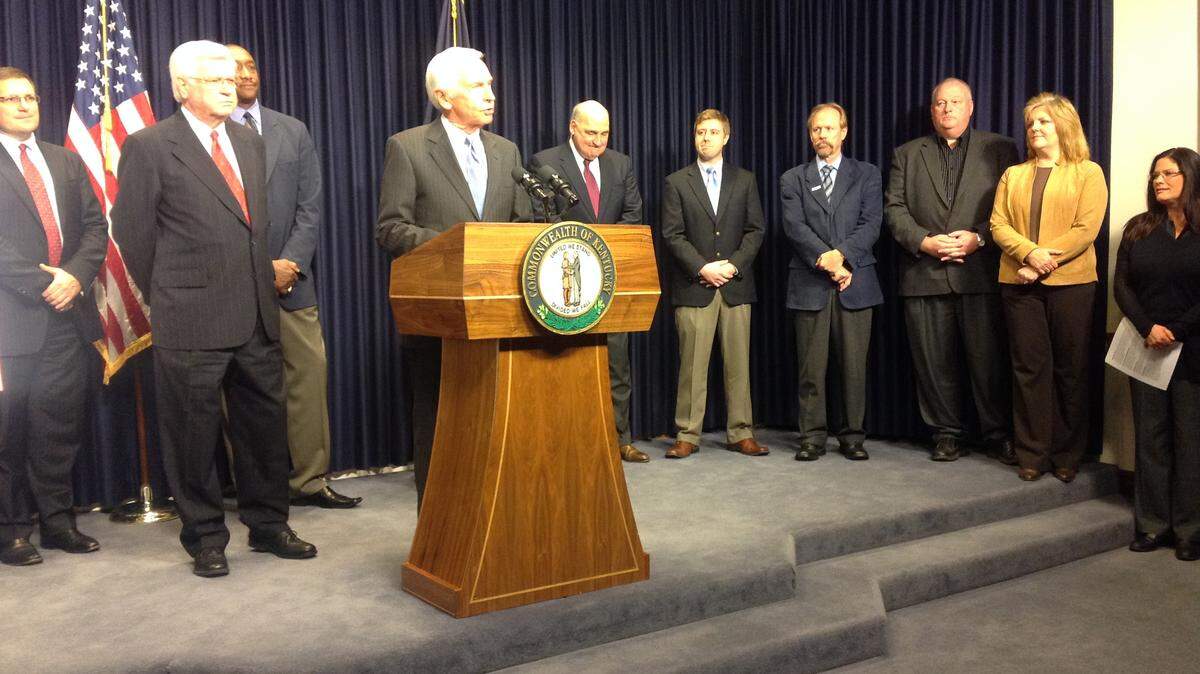 Gov. Steve Beshear, at the podium, and U.S. Hal Rogers, at his side, announce statewide broadband initiative at a Capitol news conference in Frankfort. Photo by Jack Brammer | Staff