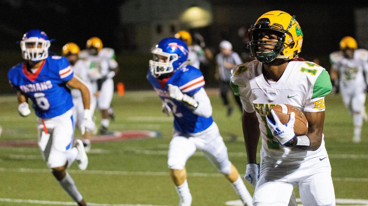 Bryan Station’s JaeVon Hurt (14) broke free on a pass pattern for a touchdown against Madison Central during their regular-season game on Oct. 22 at Madison Central. Bryan Station won 23-13.