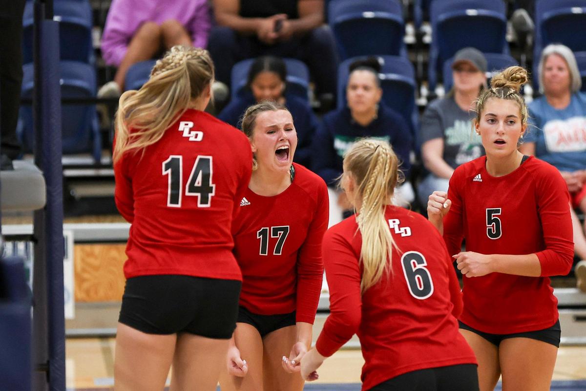 Paul Laurence Dunbar’s Delaney Gash (17) celebrates a point against Great Crossing during their regular season match on Sept. 27. The Bulldogs and Warhawks will meet again in Thursday’s 11th Region championship game at Dunbar.
