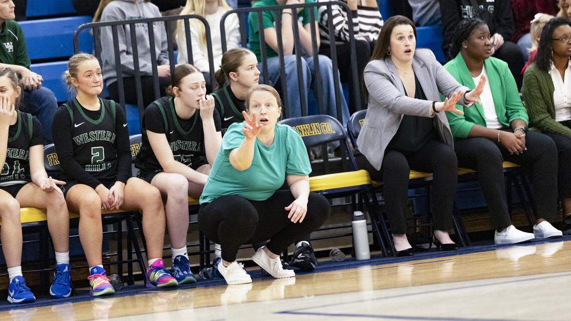 Western Hills coach Jana Hughes delivers instructions to her team during the Wolverines’ game at Franklin County High School in Frankfort on Jan. 9.