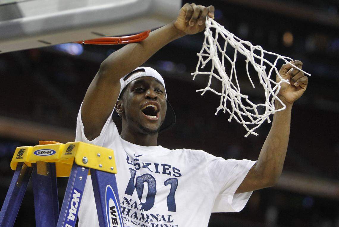 Connecticut guard Kemba Walker (15) cut down the net after the Huskies defeated Butler 53-41 in the men’s NCAA championship game in 2011. UConn got to the NCAA finals by defeating Kentucky 56-55 in the national semifinals.