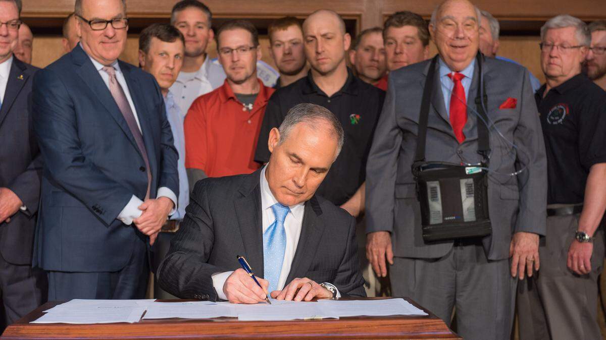 In a photo provided by the agency, Scott Pruitt, the Trump administration’s Environmental Protection Agency chief, signs an executive order as mining executives look on, in Washington, March 18, 2017. Standing second left is Joseph Craft, a billionaire executive, who has maintained a close behind-the-scenes relationship with Pruitt as the EPA has handed Craft a string of regulatory victories. (Eric Vance/Environmental Protection Agency via The New Yorkt Times)