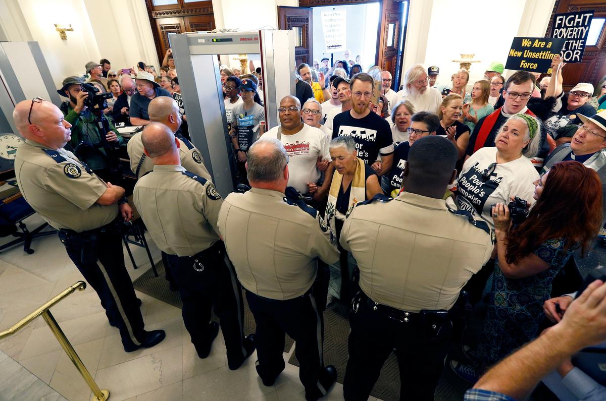 After being told the entire group would not be granted access to the Capitol, the Kentucky Poor People's Campaign gathered in the front lobby as police formed a line to block them Monday afternoon in Frankfort.