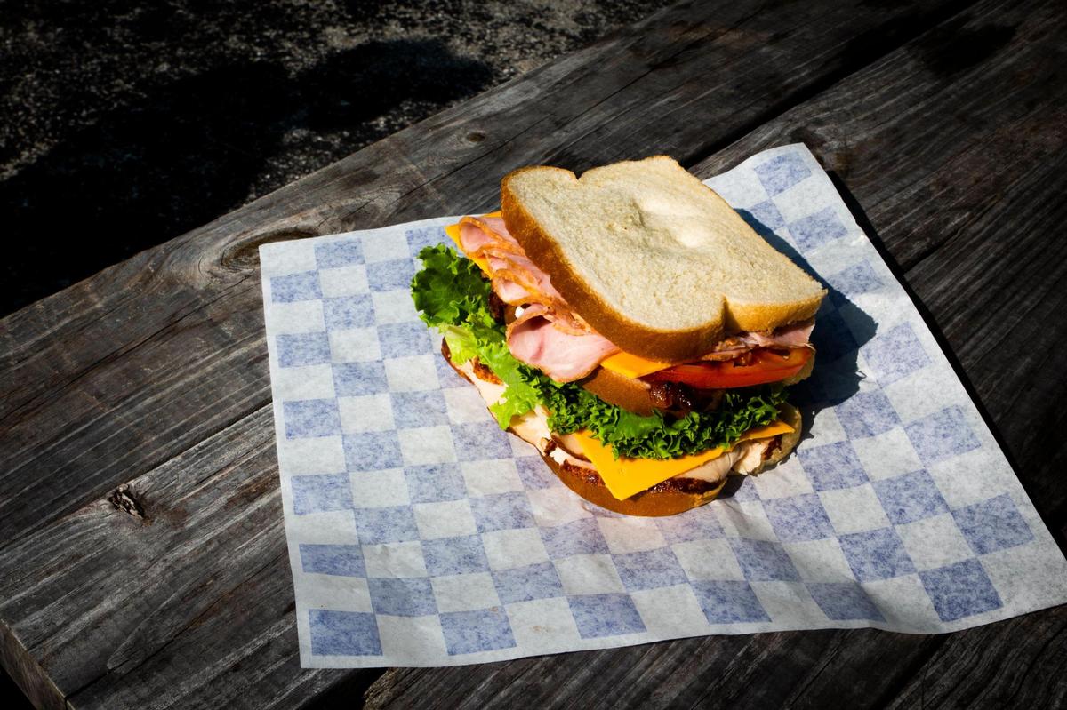A Club sandwich on white at Wilson’s Grocery.