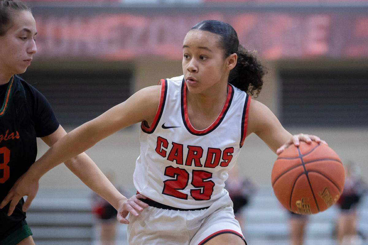 George Rogers Clark’s Anaya Chestnut (25) drives the ball against Frederick Douglass during a game in Winchester on Dec. 15, 2023.