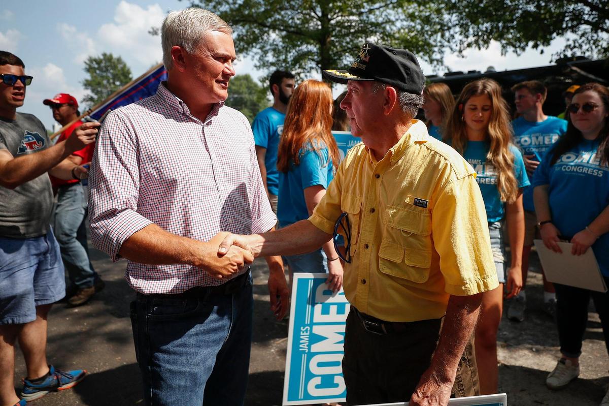 U.S. Rep. James Comer, left, greets Jim Hagan, of Gilbertsville, Ky., during the 141st Fancy Farm Picnic at St. Jerome Catholic Church in Fancy Farm, Ky., Saturday, Aug. 7, 2021.