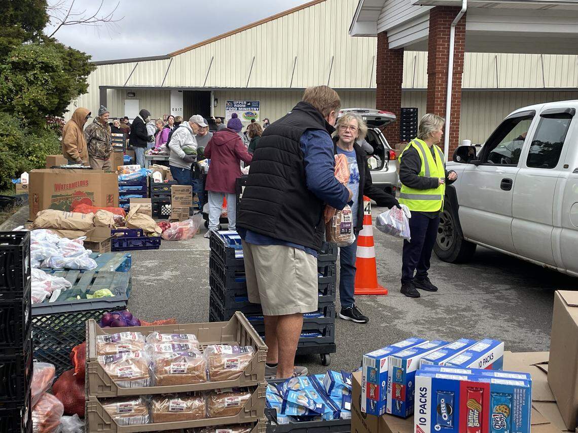 Volunteers and members of Calvary Baptist Church in London provide food donation boxes to the public Monday, Nov. 3, 2025. The group does a food donation the second Monday of each month.