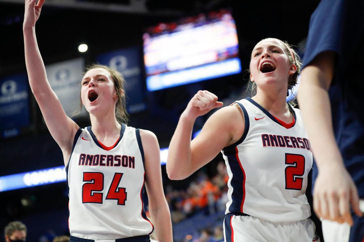 Anderson County’s Tiffani Riley (24) and Sophie Smith (2) celebrate after their opening-round victory. The Bearcats face Franklin County next.