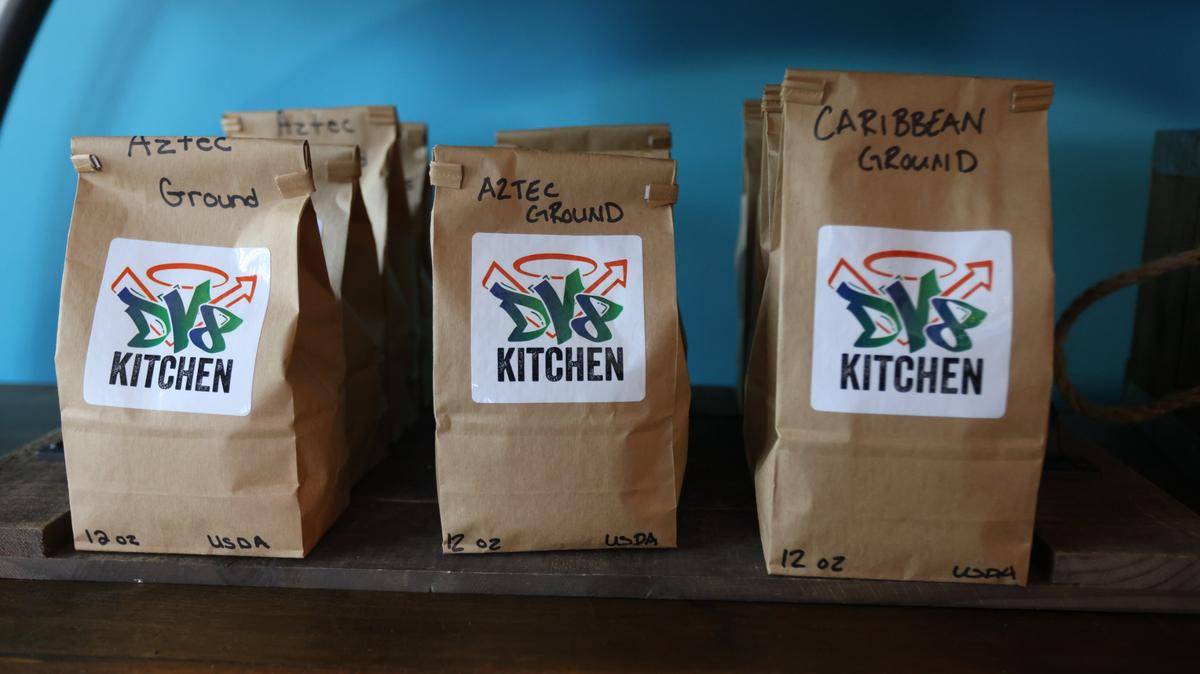 Bags of coffee sold within the new DV8 Kitchen location on the corner of East Third and Midland.