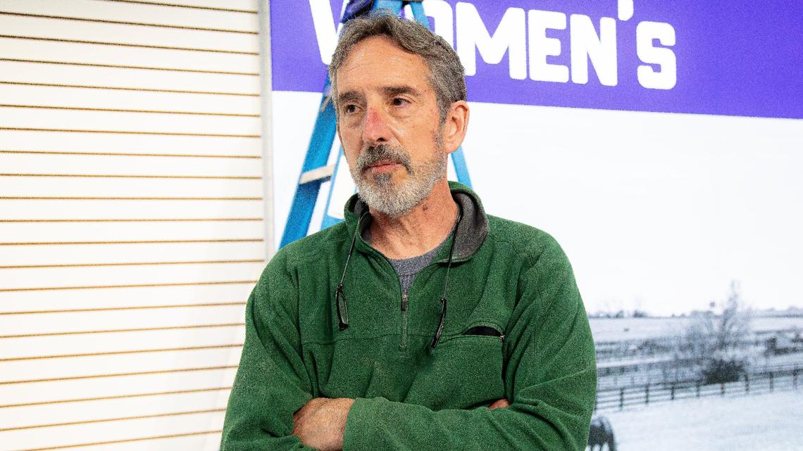 J&H Outdoors footwear buyer, Woody DePerna, explains why he supports the J&H Running Co. business model, assisting with grand opening preparations on May 22, 2025, in Lexington, Ky.