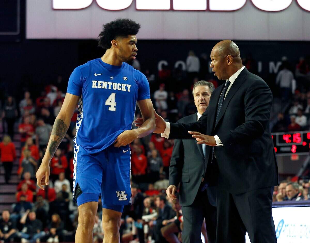 Kentucky’s Nick Richards (4) listened to UK assistant Kenny Payne during the Wildcats’ 69-49 win at Georgia.