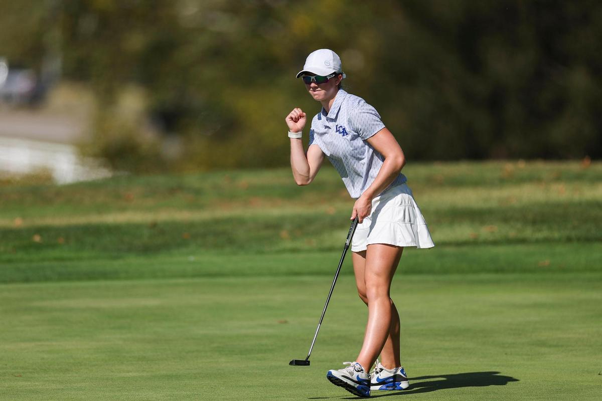 Lexington Christian’s C.A. .Carter celebrates her birdie putt on the 18th hole of the Region 9 Championship girls high school golf tournament at the University Club at Arlington in Richmond on Tuesday.