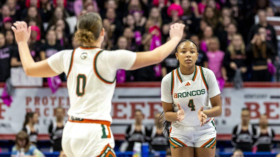 Frederick Douglass' Tamia Waide (4), right, celebrates with Frederick Douglass' Reagan Gregonis (0) after Waide made a second-half three-pointer during the Broncos' 32-30 loss in a second-round game in the 2026 Clark's Pump-N-Shop Girls' Basketball Sweet 16, Friday, March 13, 2026 at Rupp Arena in Lexington, Ky.