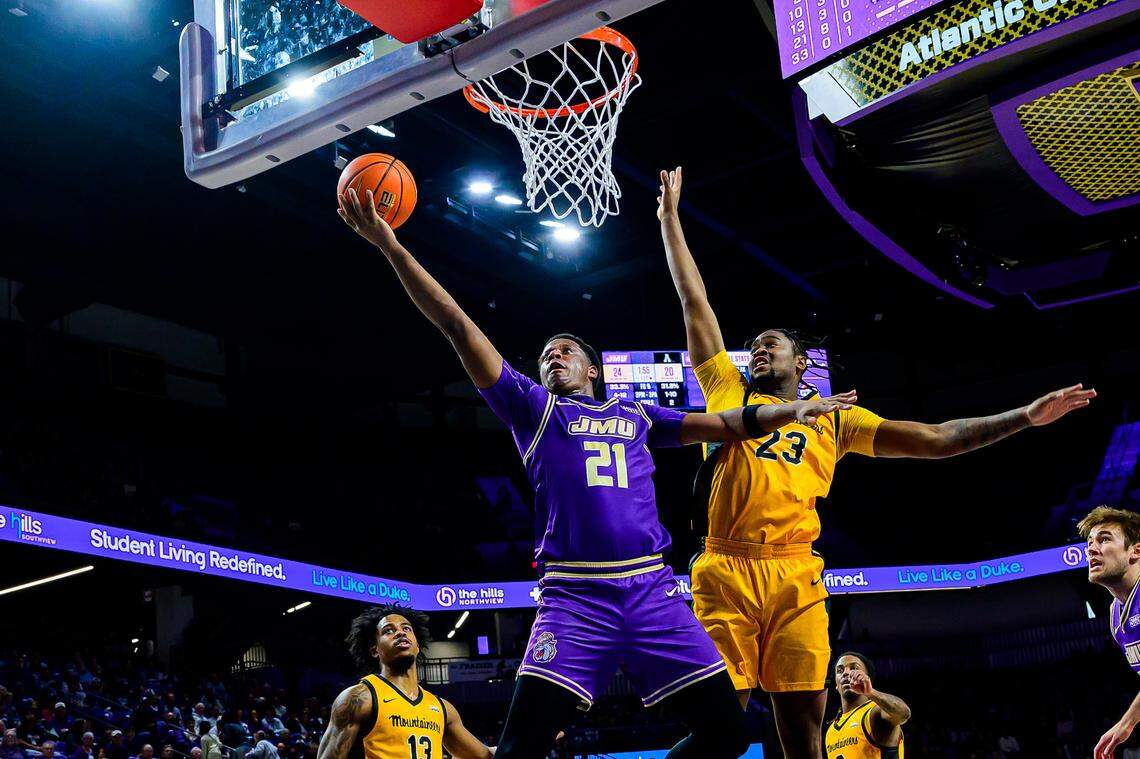 James Madison junior forward Justin McBride (21) averaged 15.3 points and 5.6 rebounds per game this past season for the Dukes.