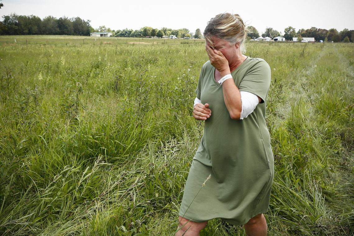 Jodie Coulter, of Moreland, Ky., is overcome with emotion near the site of her former home following a gas line explosion that left one woman dead in Moreland, Ky., Thursday, Aug. 1, 2019. Coulter lost her home in the blast.