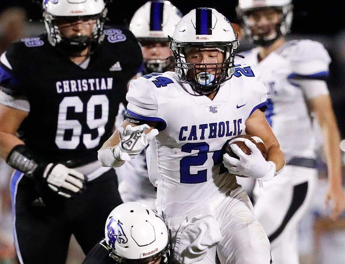 Lexington Catholic’s Walker Hall (24) carries the ball during a game at Lexington Christian on Sept. 17, 2021.