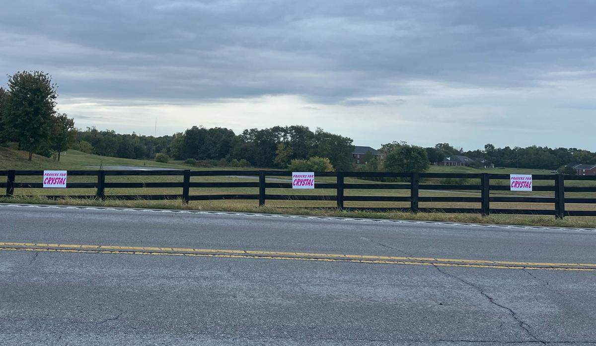 “Prayers for Crystal” signs line a road in Bardstown, Ky., outside the neighborhood where Brooks Houck lives. Houck was arrested this week and charged with murder and evidence tampering in Crystal Rogers’ death