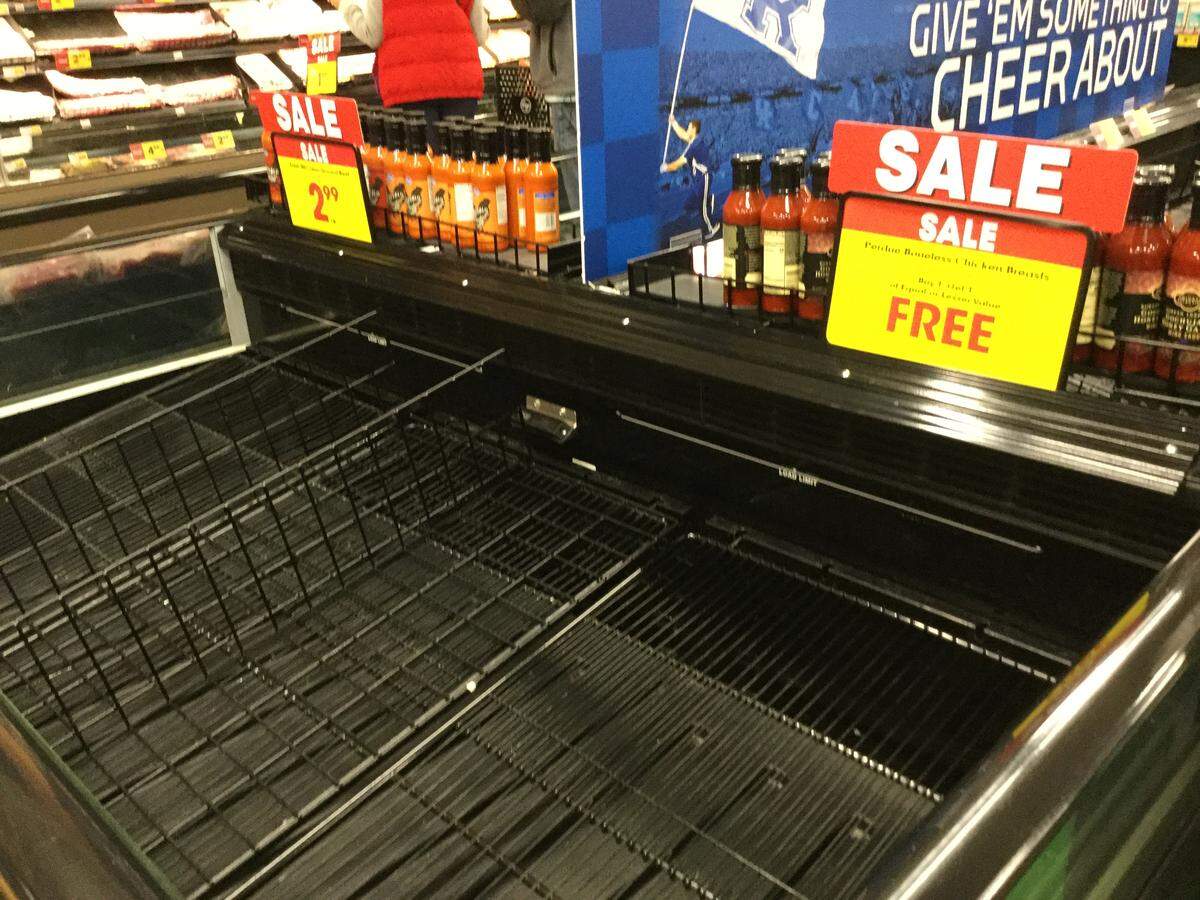 Empty meat cases at Kroger in mid-March. Stores have seen some return of ground beef, chicken breasts and pork, but shortages remain. Now, with processing plants hit hard by the coronavirus, the shortages aren’t going away anytime soon, experts say.